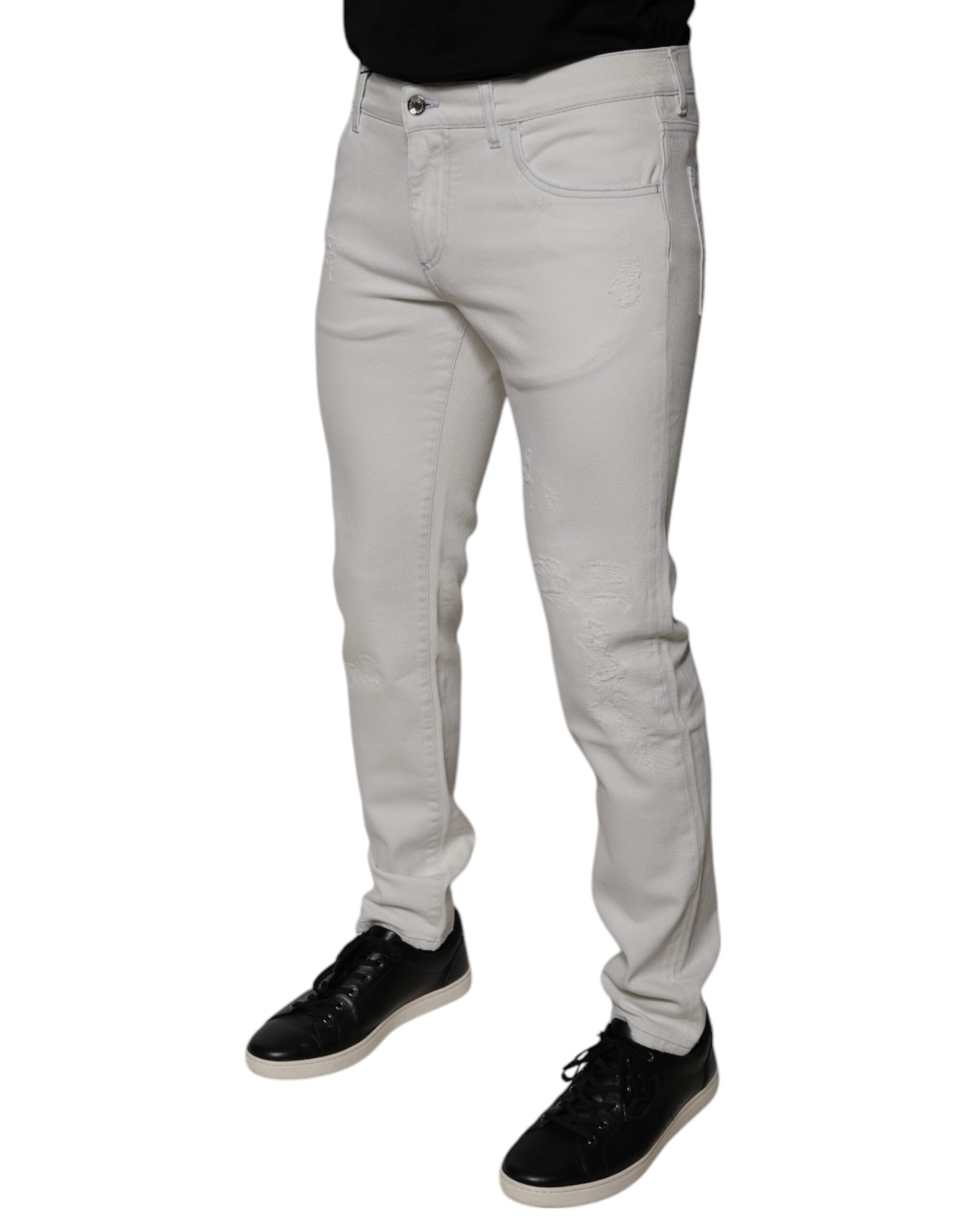 Jean homme skinny en coton stretch blanc Dolce & Gabbana, coupe ajustée et détails classiques.