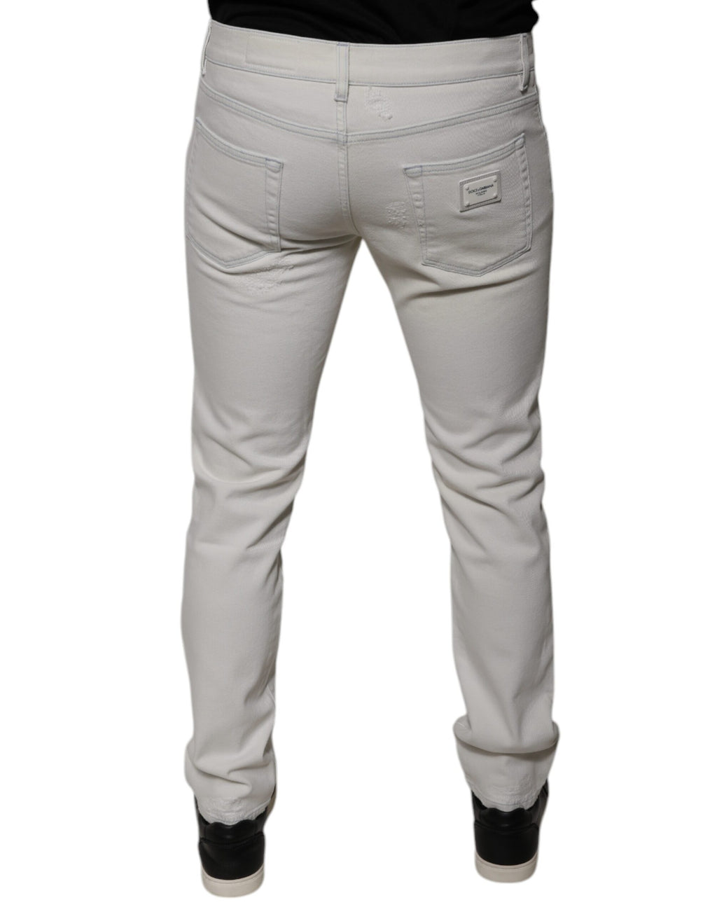 Jeans slim en coton stretch blanc pour homme de Dolce & Gabbana, coupe skinny, visible détail de la texture du denim.