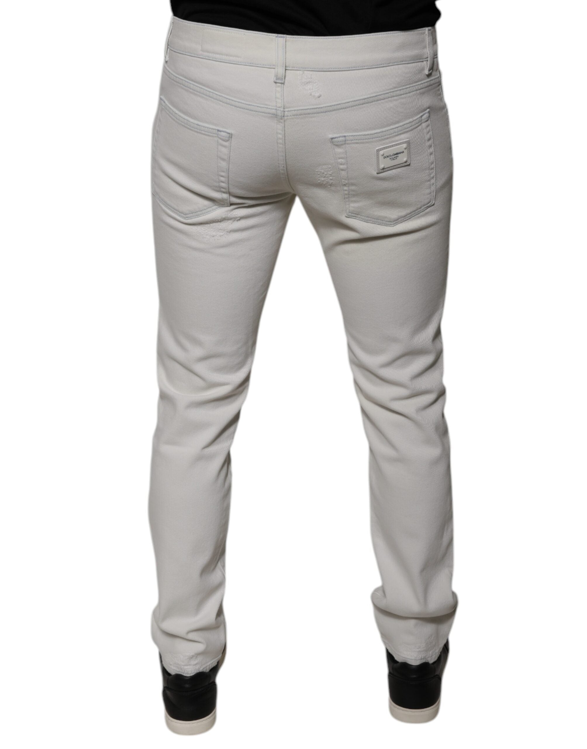 Jeans slim en coton stretch blanc pour homme de Dolce & Gabbana, coupe skinny, visible détail de la texture du denim.