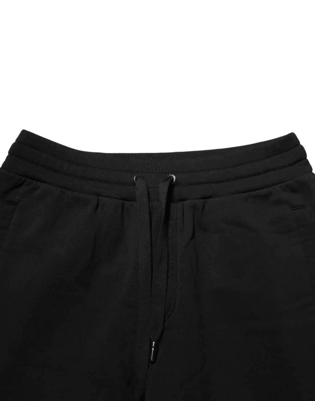 Pantalon de jogging en coton noir Dolce & Gabbana avec logo DG, style décontracté et confortable, vue de face.
