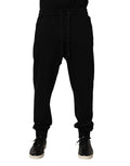 Pantalon de jogging en coton noir Dolce & Gabbana avec logo DG, style décontracté et confortable.