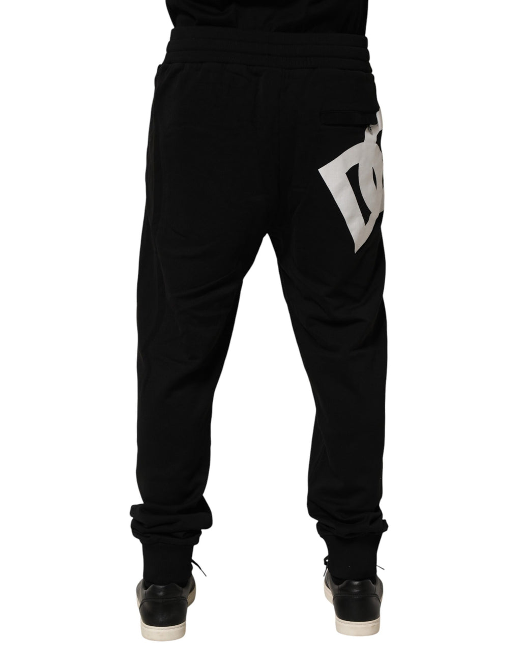 Pantalons jogging en coton noir Dolce & Gabbana avec logo DG, style décontracté et confortable, visibles sur le produit.