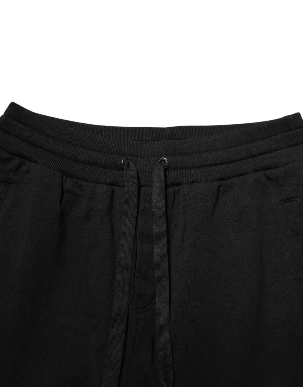 Pantalons de jogging en coton noir Dolce & Gabbana avec logo DG imprimé, style décontracté et confortable, vue de face.
