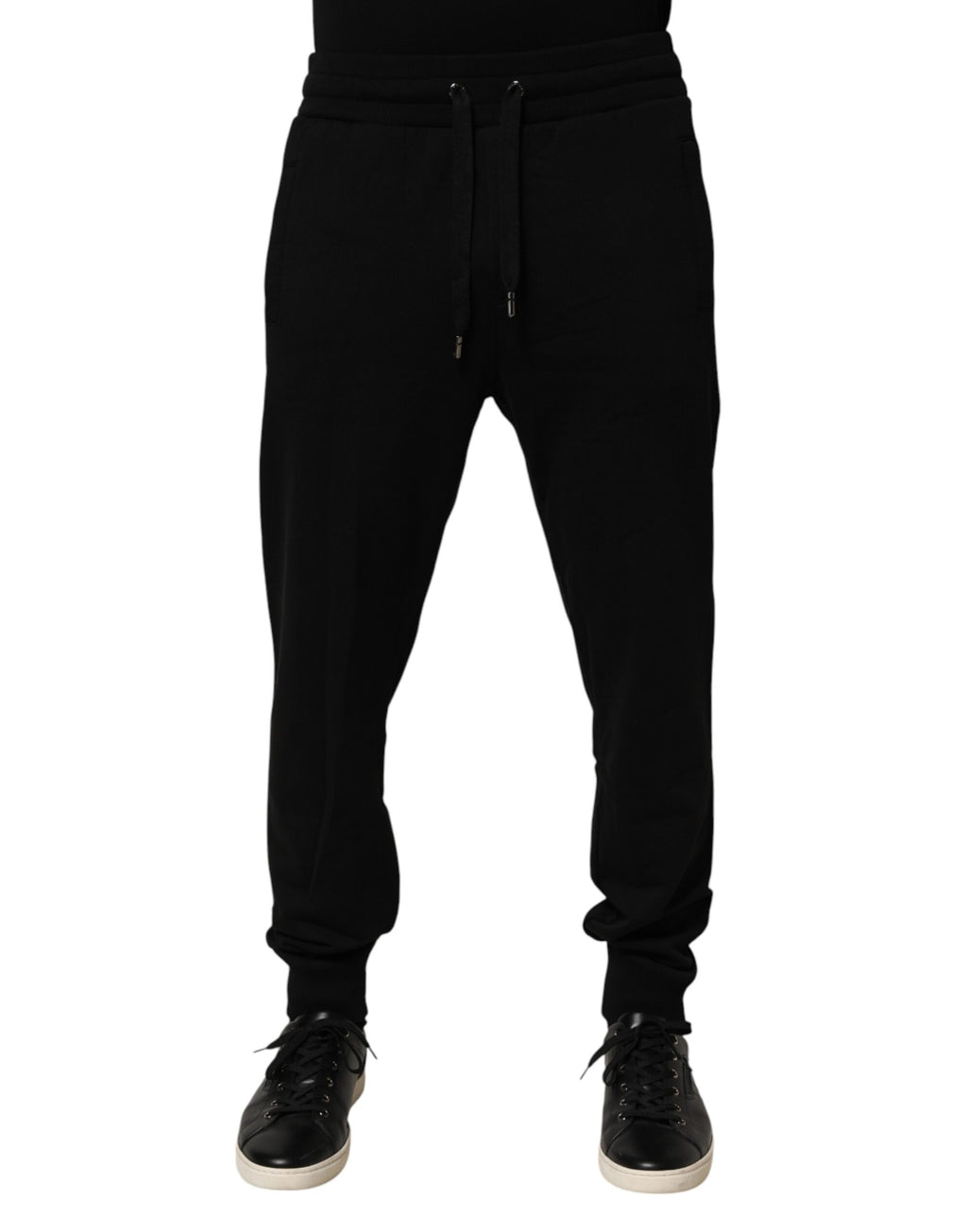 Pantalon de jogging en coton noir Dolce & Gabbana avec logo DG, style décontracté et confortable, vue de face.