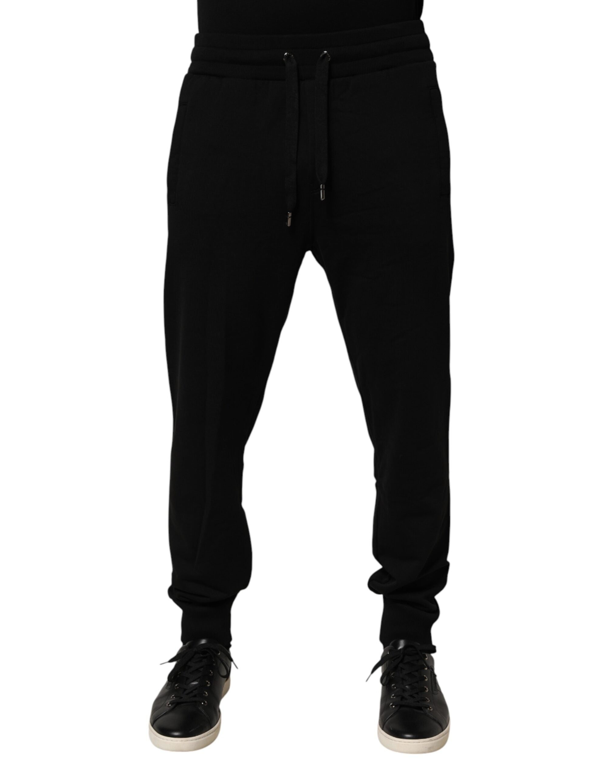 Pantalon de jogging en coton noir Dolce & Gabbana avec logo DG, style décontracté et confortable, vue de face.