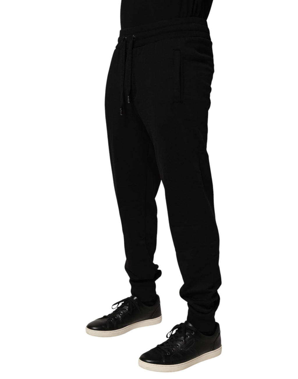Pantalon jogging en coton noir Dolce & Gabbana avec logo DG, style décontracté et confortable, visible en gros plan.