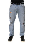 Jean slim en denim bleu Dolce & Gabbana en coton avec effet déchiré, ajusté et tendance.