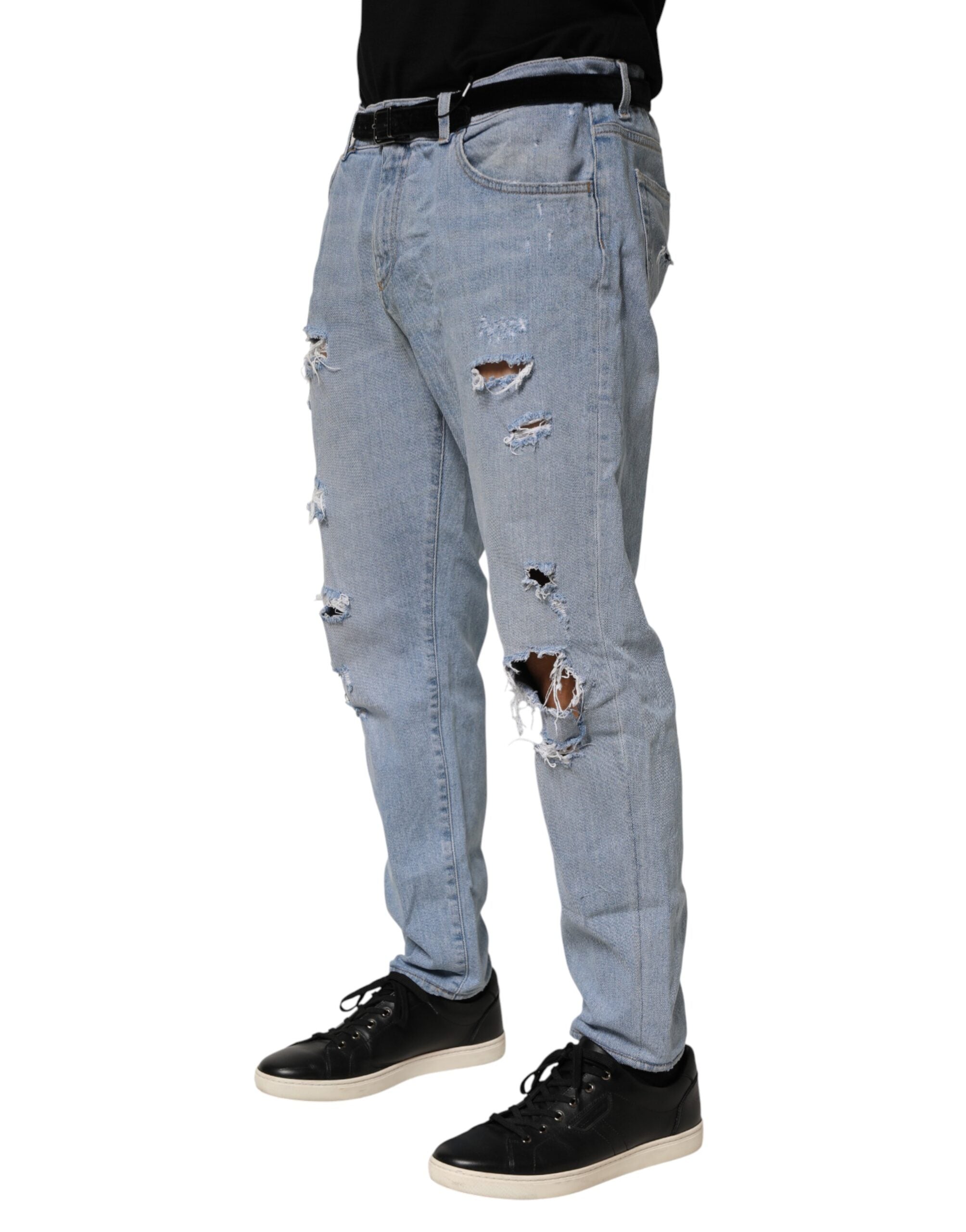 Jeans slim en denim bleu Dolce & Gabbana en coton avec détails déchirés et style ajusté.