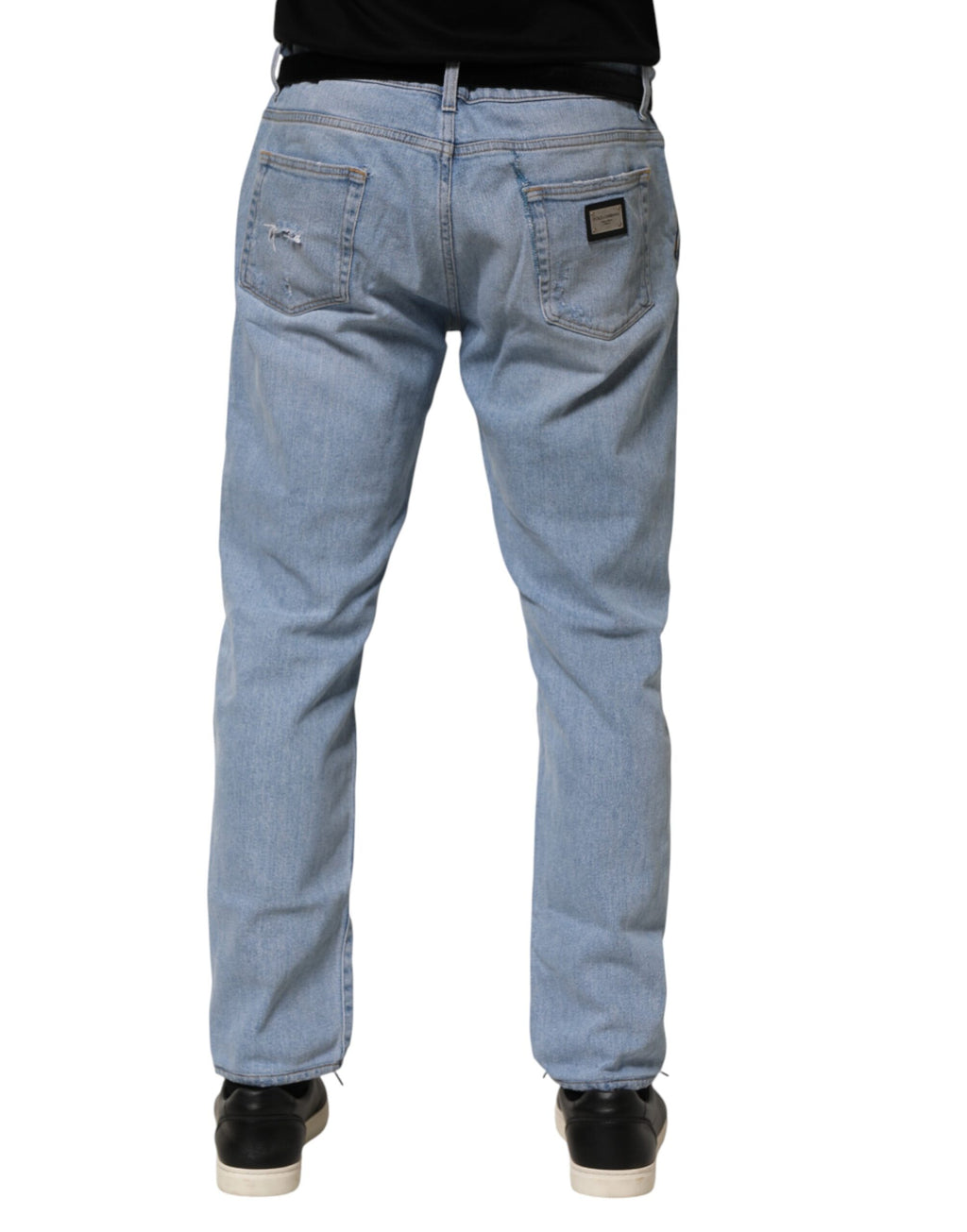 Jeans slim en denim bleu Dolce & Gabbana en coton avec effet déchiré, ajustés et modernes.