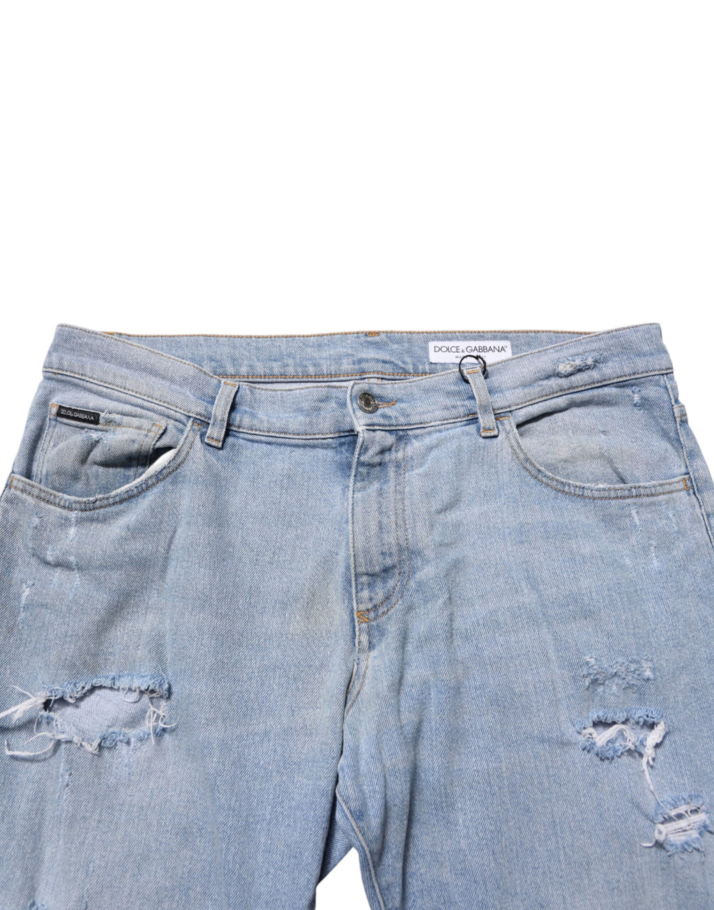 Jeans slim déchirés en coton bleu Dolce & Gabbana, style décontracté et moderne, visible avec détails usés et coupe ajustée.