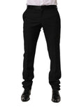 Pantalon formel en laine noire de Dolce & Gabbana pour homme, élégant et ajusté, visible en gros plan.
