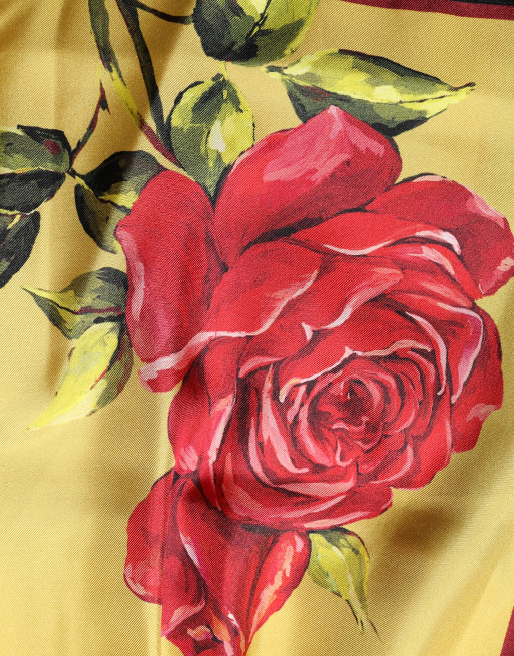 Shorts bermuda en soie jaune à imprimé floral pour homme de Dolce & Gabbana, avec motif print coloré et style élégant.