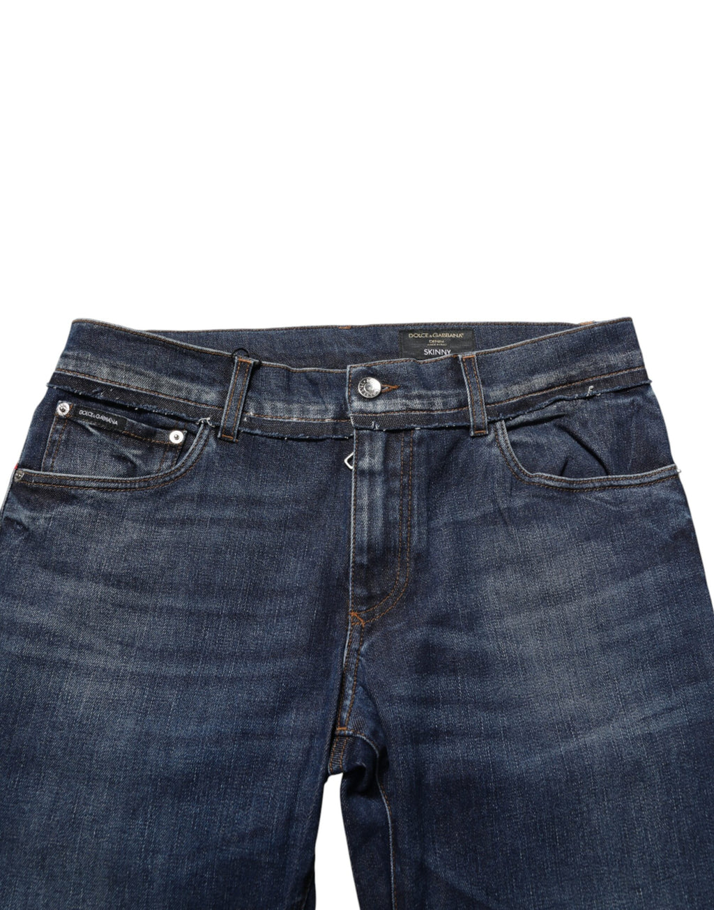 Jeans slim en coton stretch bleu Dolce & Gabbana pour homme, coupe skinny, détails en denim avec fermeture éclair et boutons.