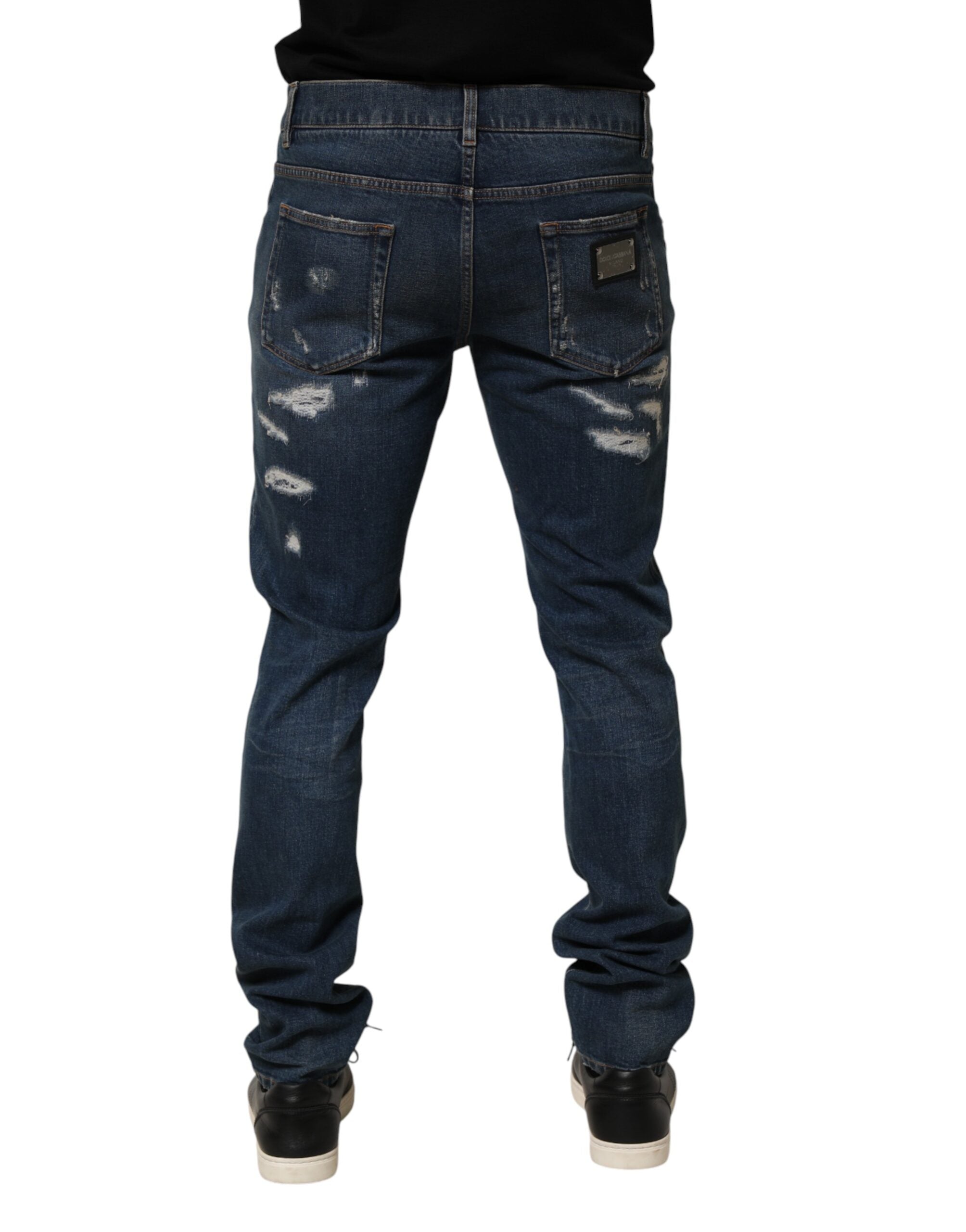 Jeans skinny en coton déchiré bleu de Dolce & Gabbana pour homme, denim tendance avec détails usés.
