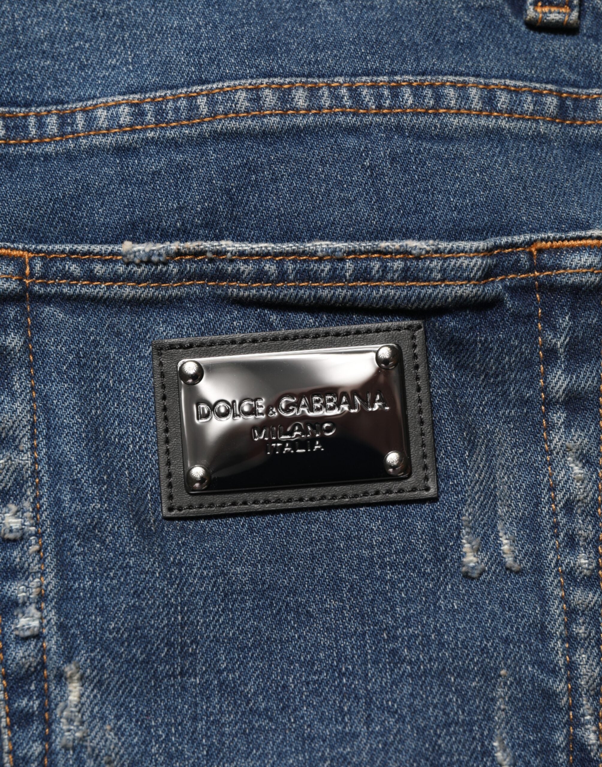 Jeans slim en denim coton déchiré bleu de Dolce & Gabbana pour homme, style tendance et ajusté.