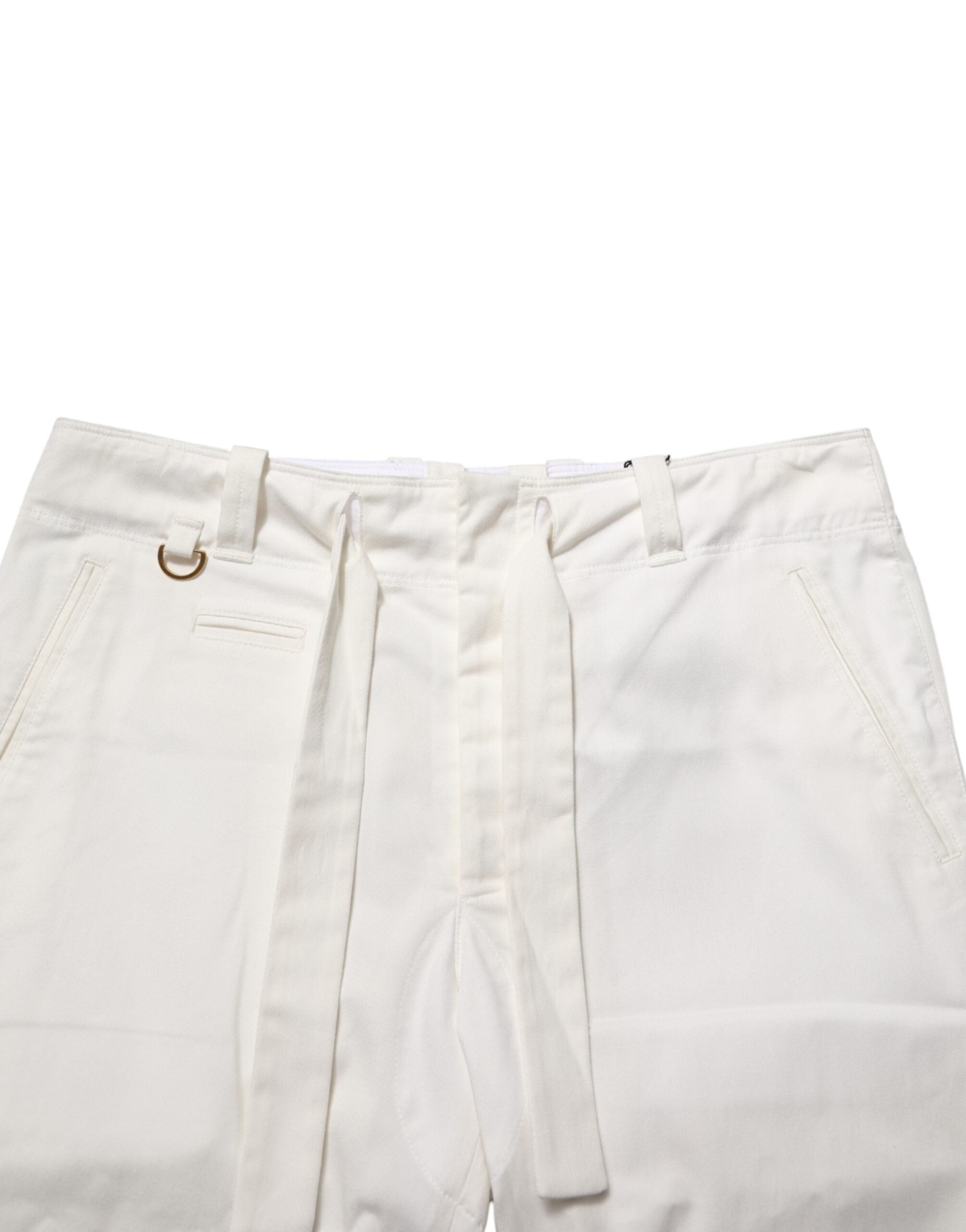 Pantalons cropped en coton stretch blanc de Dolce & Gabbana, style élégant et moderne, visible avec ceinture et coupe ajustée.