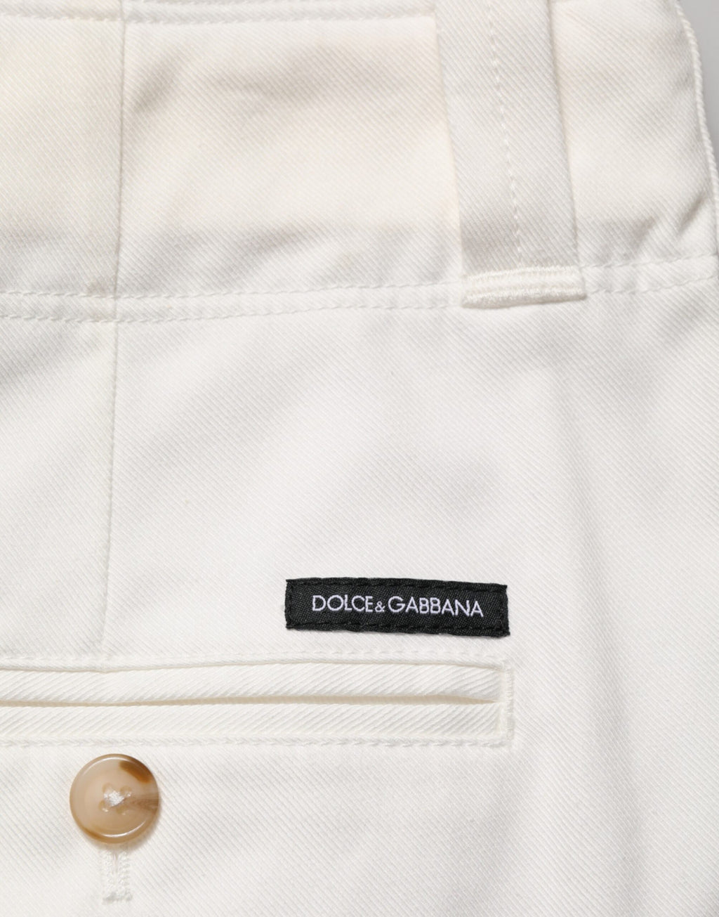 Pantalon cropped en coton stretch blanc de Dolce & Gabbana, pantalon chic avec coupe ajustée et tissu confortable.