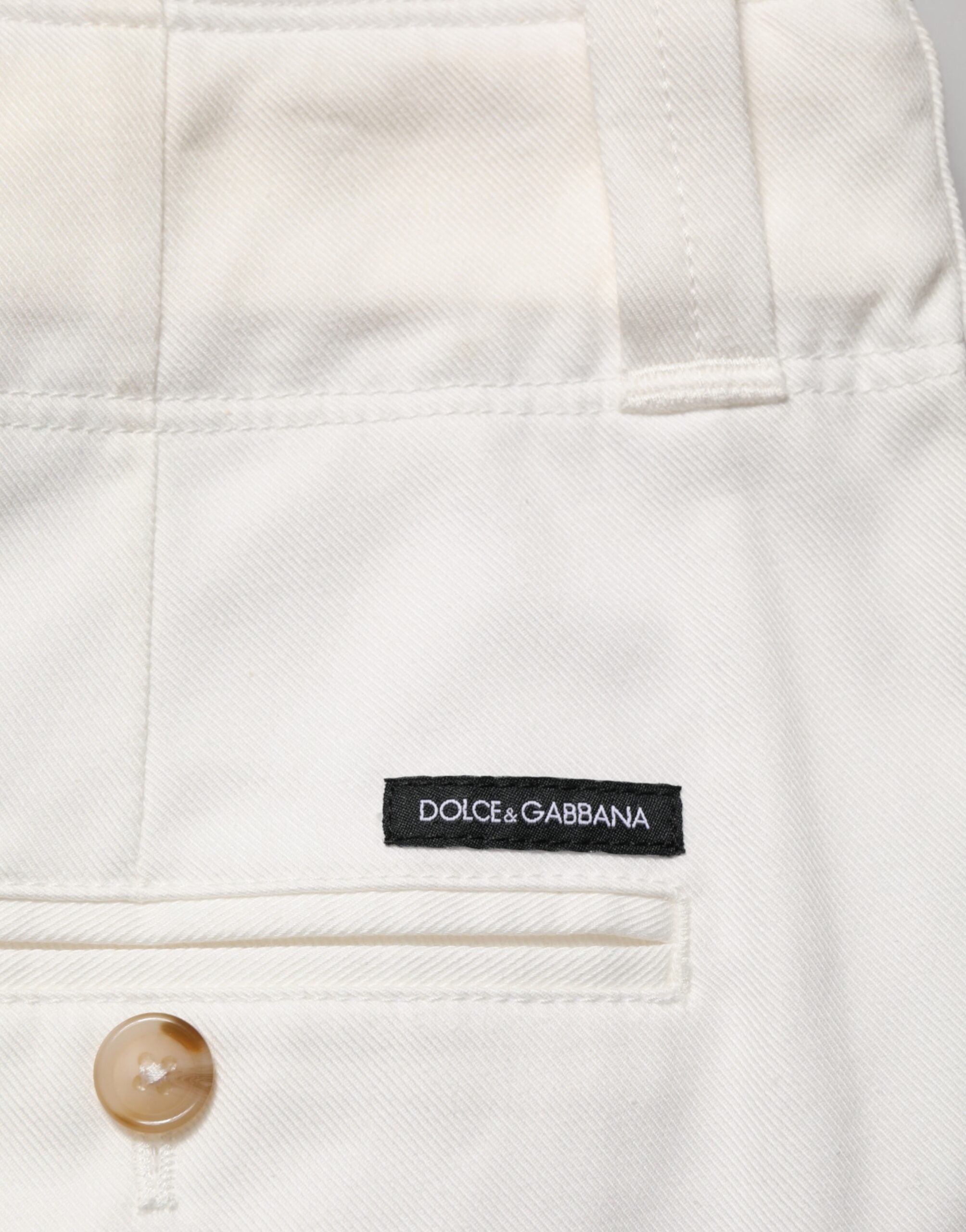 Pantalon cropped en coton stretch blanc de Dolce & Gabbana, pantalon chic avec coupe ajustée et tissu confortable.