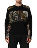 Pull noir Dolce & Gabbana en patchwork avec col rond, en laine, visible en gros plan sur le pull.