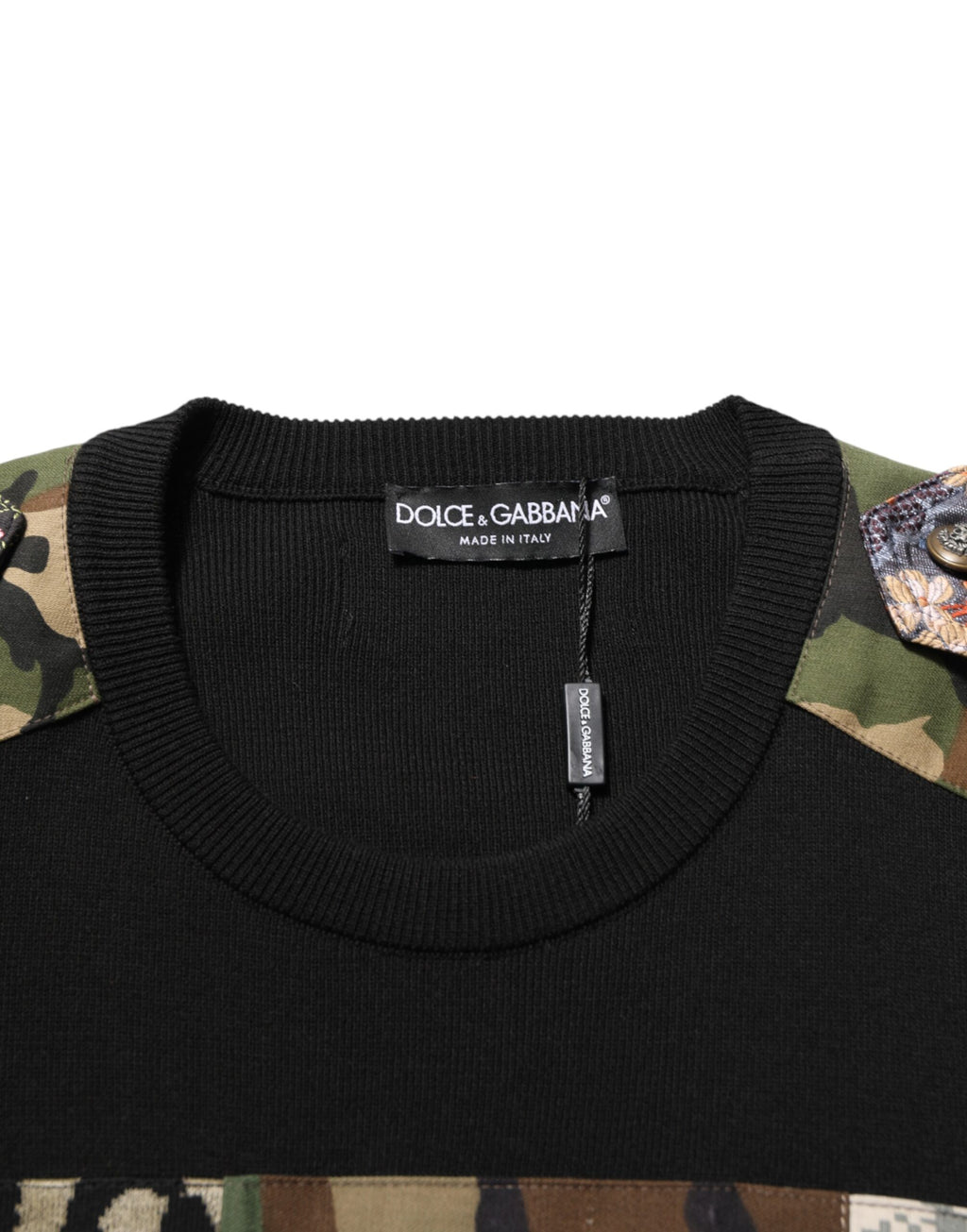 Pull à col rond Dolce & Gabbana en patchwork noir, sweater en maille avec design unique et détails de couture visibles.