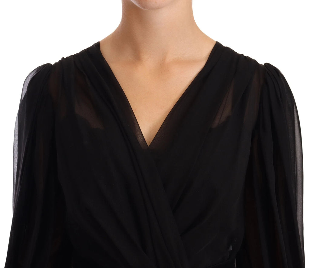 Robe longue en soie noire et tulle Dolce & Gabbana à manches longues et col en V, élégante et sophistiquée.