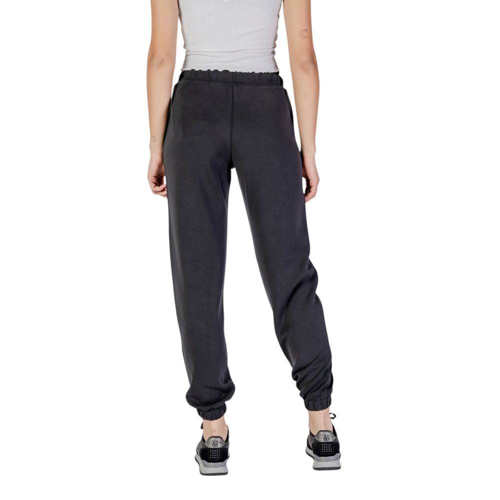 Pantalons de jogging actifs Guess Active en polyester noir, confortables pour l'entraînement et le sport.