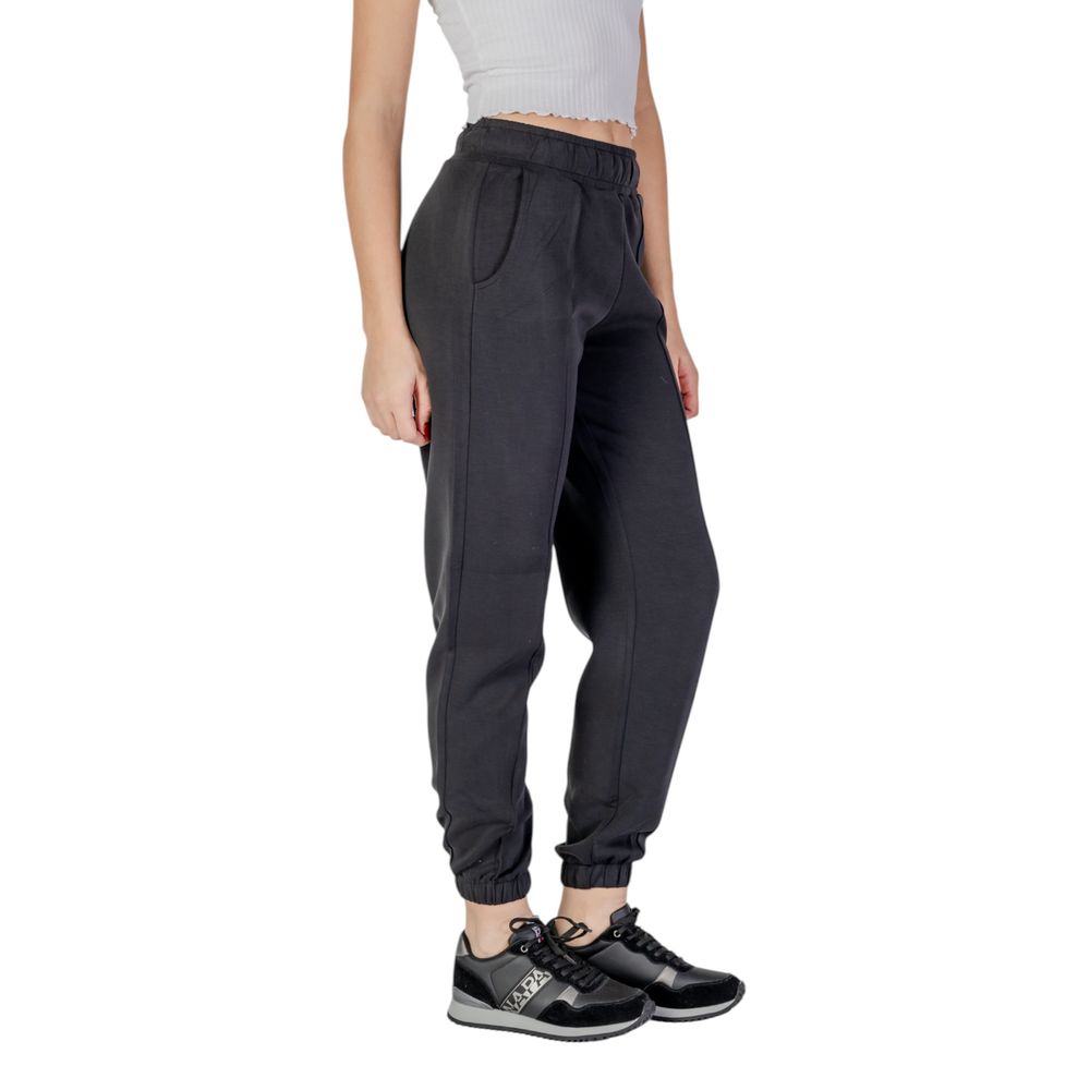 Pantalons de jogging Guess Active en polyester noir pour entraînement, avec ceinture élastique et poches latérales.