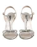 Sandales à talons Dolce & Gabbana en argent avec bride à la cheville et strass, visibles en gros plan.