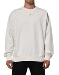 Sweat-shirt à col rond blanc Dolce & Gabbana avec logo DG, pull en coton à manches longues et design épuré.