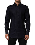 Chemise homme Dolce & Gabbana en coton bleu à col classique à manches longues avec boutons dorés.