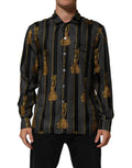 Chemise en soie noire à pois et pompons Dolce & Gabbana, boutonnière élégante et détails raffinés.