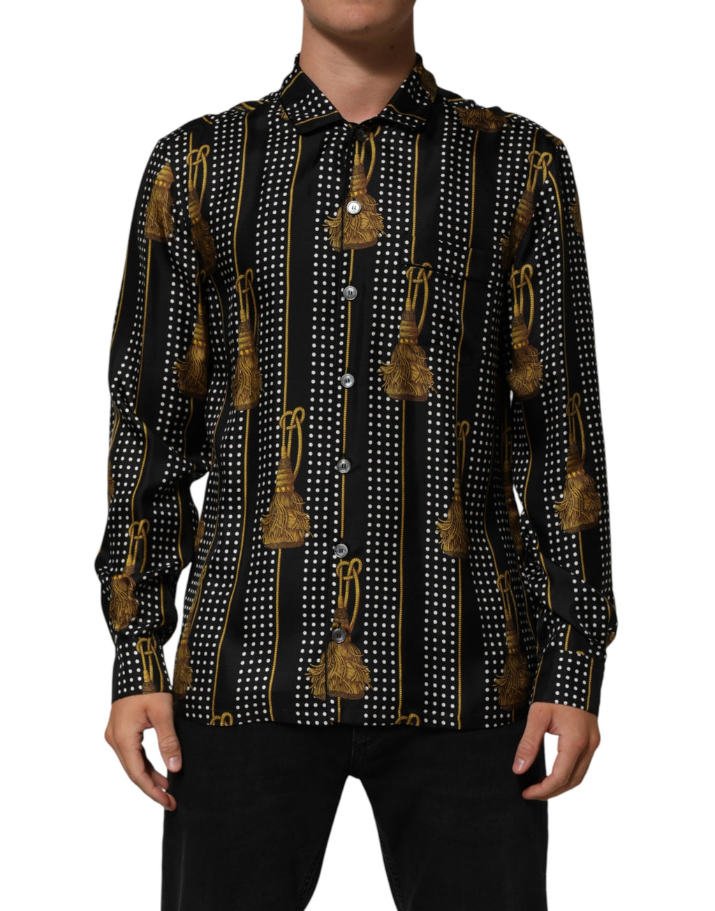 Chemise en soie noire à pois Dolce & Gabbana avec boutons et gland, détails élégants visibles sur l'image.