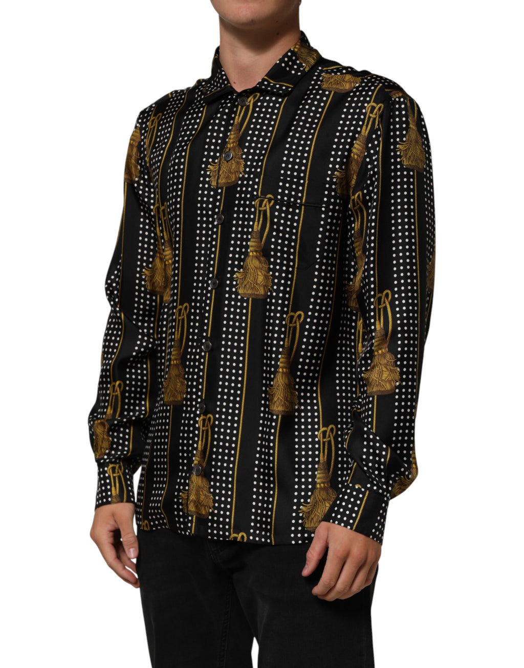 Chemise Dolce & Gabbana en soie noire à pois, avec boutons et pompons, style élégant et sophistiqué.