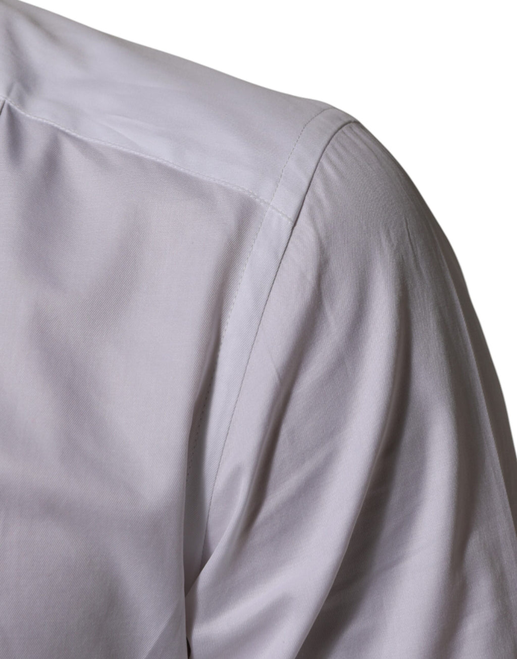 Chemise habillée blanche en coton Dolce & Gabbana avec col montant et détails dorés, vue de face.