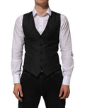 Gilet homme formel en laine noire de la marque Dolce & Gabbana, ajusté, avec col en V et boutons devant.
