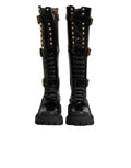 Bottes hautes noires Dolce & Gabbana avec boucle ornée et embellissements, en cuir élégant et sophistiqué.