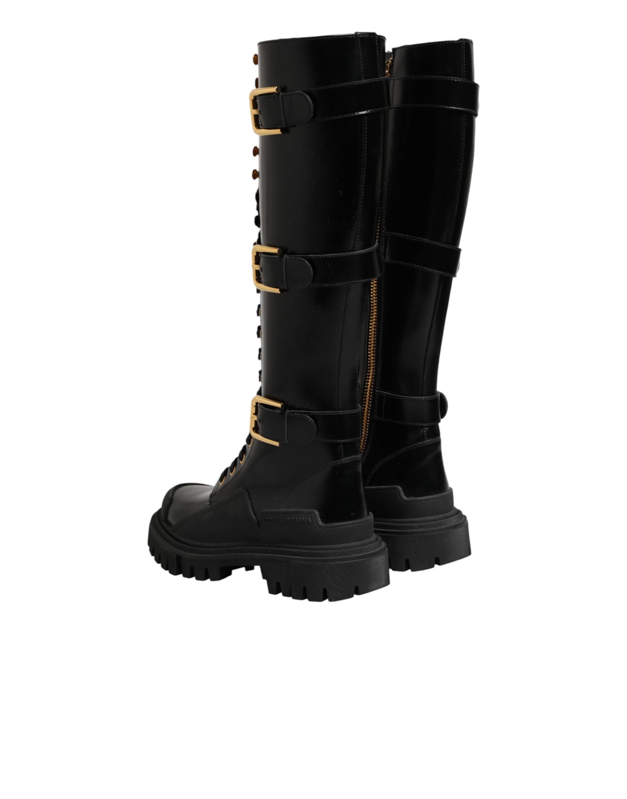 Bottes hautes noires Dolce & Gabbana avec boucle ornementale et détails brillants, en cuir élégant pour femme.