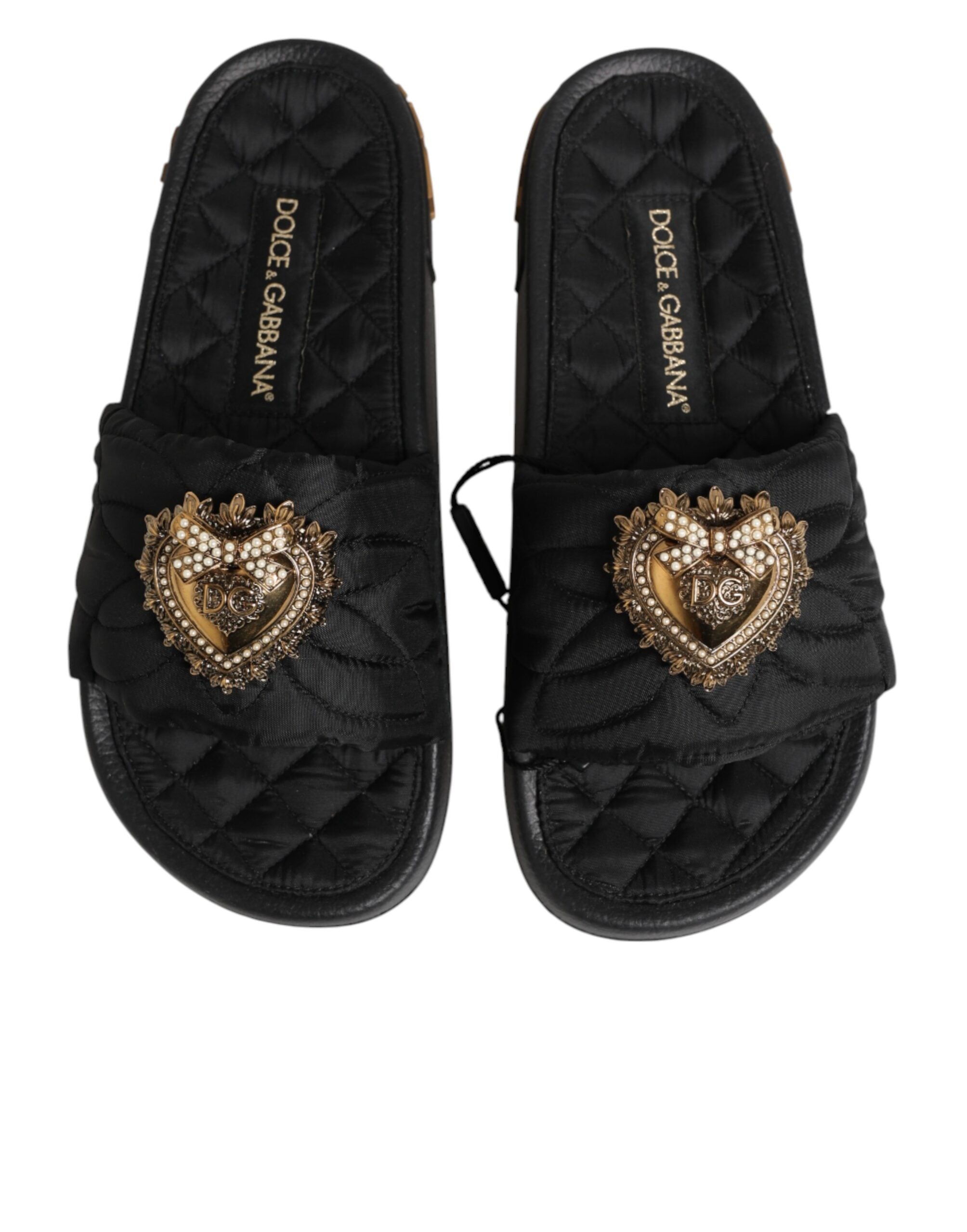 Chaussures Dolce & Gabbana Devotion en cuir matelassé noir, sandales élégantes à semelle plate et design sophistiqué.