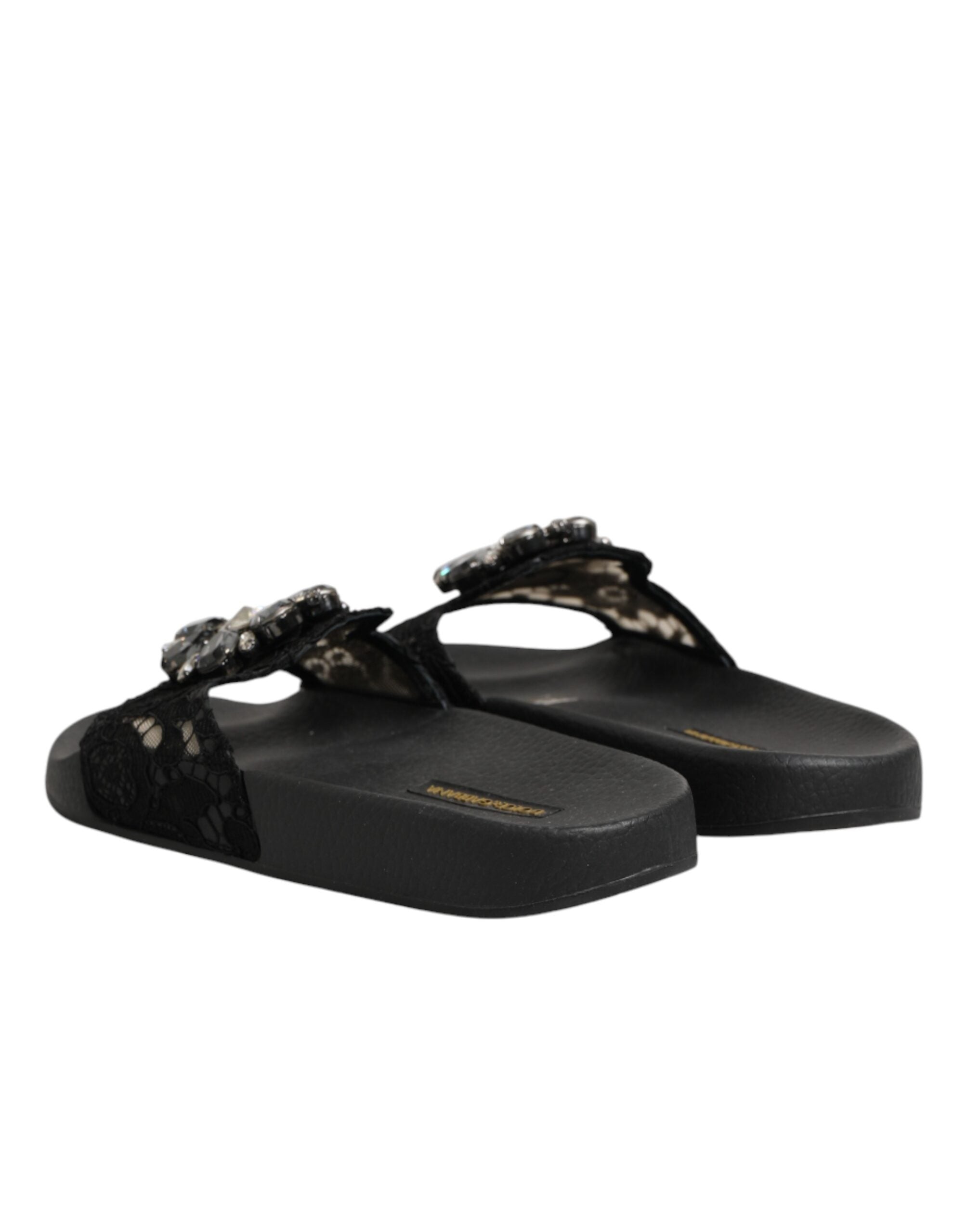Chaussures Dolce & Gabbana Devotion en cuir matelassé noir, slides élégantes avec design sophistiqué.