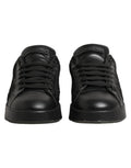Chaussures sneakers basses Dolce & Gabbana en dentelle florale noire, élégantes et modernes, vues de face.