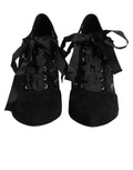 Chaussures à talons noires Dolce & Gabbana avec motifs floraux, lacets et design élégant pour femmes.