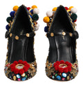 Chaussures à talons Dolce & Gabbana Mary Janes noires avec embellissements dorés et détails élégants.