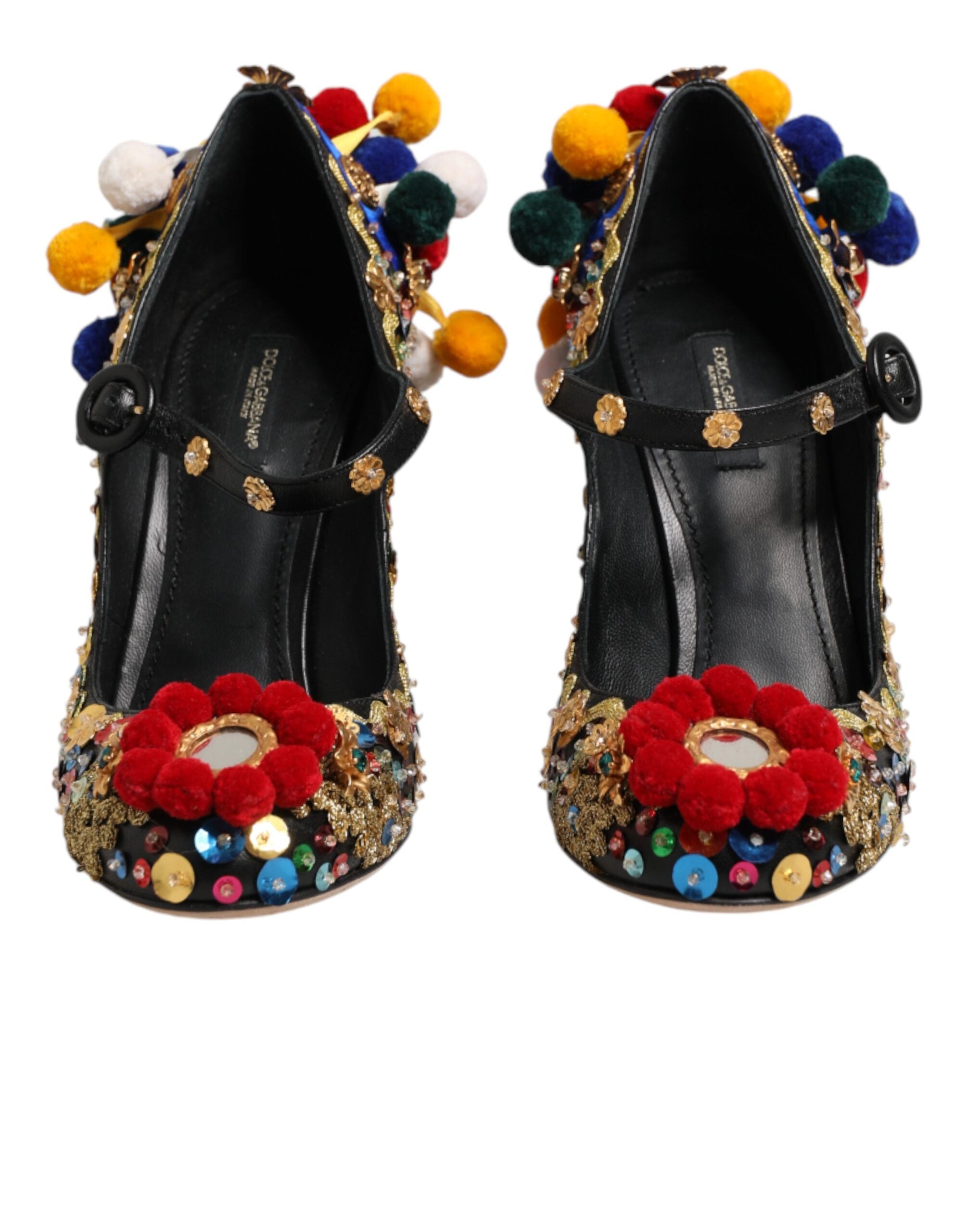 Chaussures Dolce & Gabbana Mary Janes noires avec détails dorés et embellissements, vue de face.