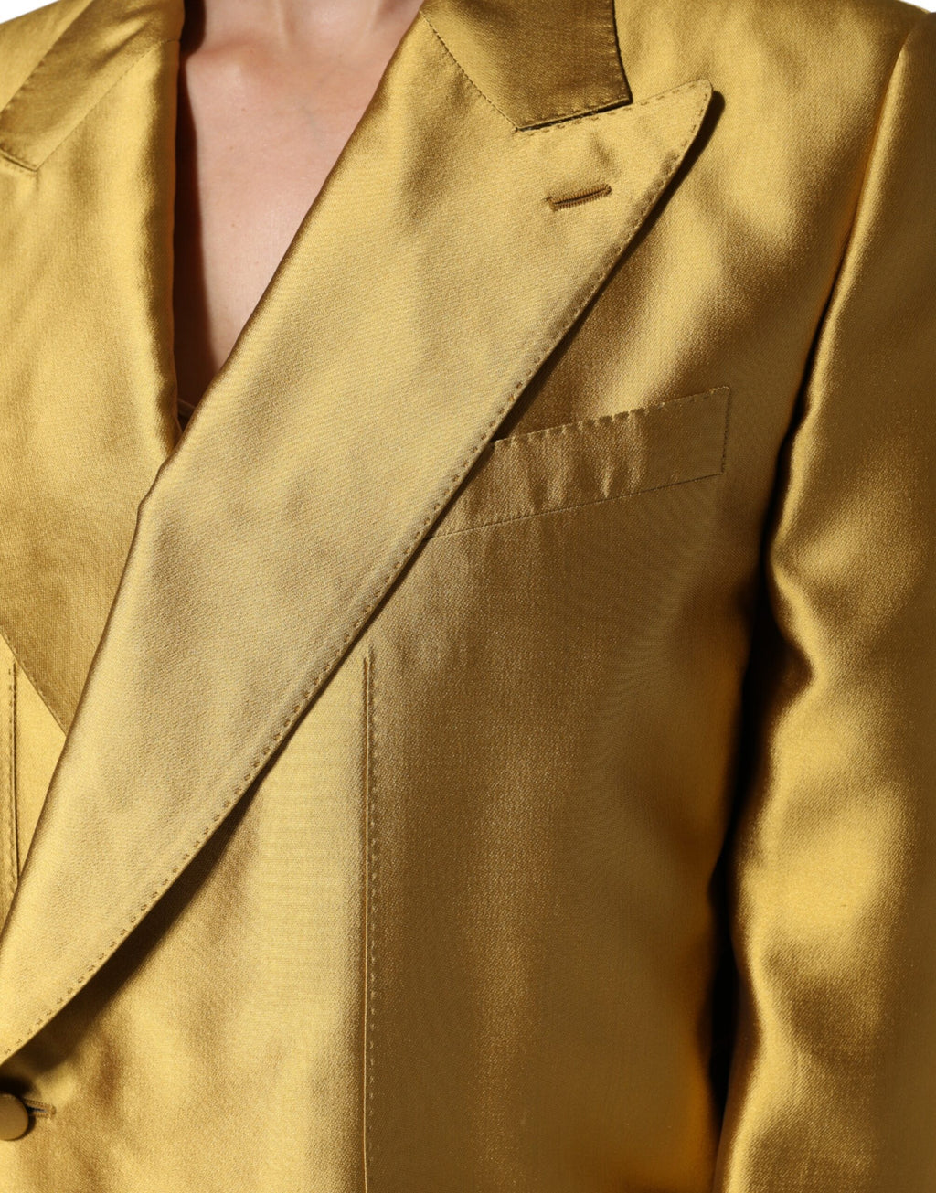 Veste blazer longue en satin doré à manches longues de Dolce & Gabbana, élégante et sophistiquée.