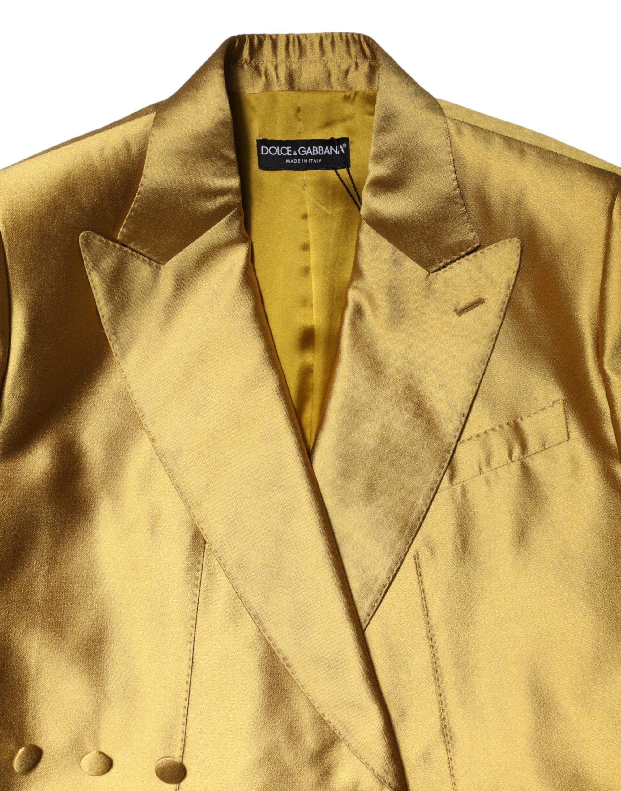Veste blazer longue en satin doré Dolce & Gabbana avec manches longues et coupe élégante, vue de face.