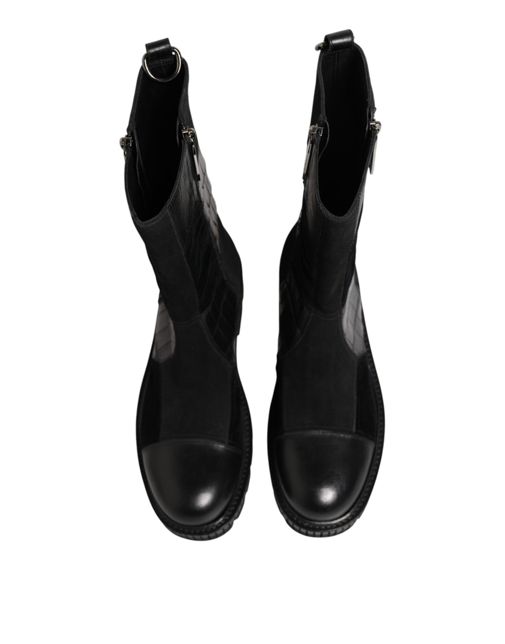 Bottes en cuir patchwork noir Dolce & Gabbana mi-mollet, style élégant et moderne, avec détails de couture visibles.
