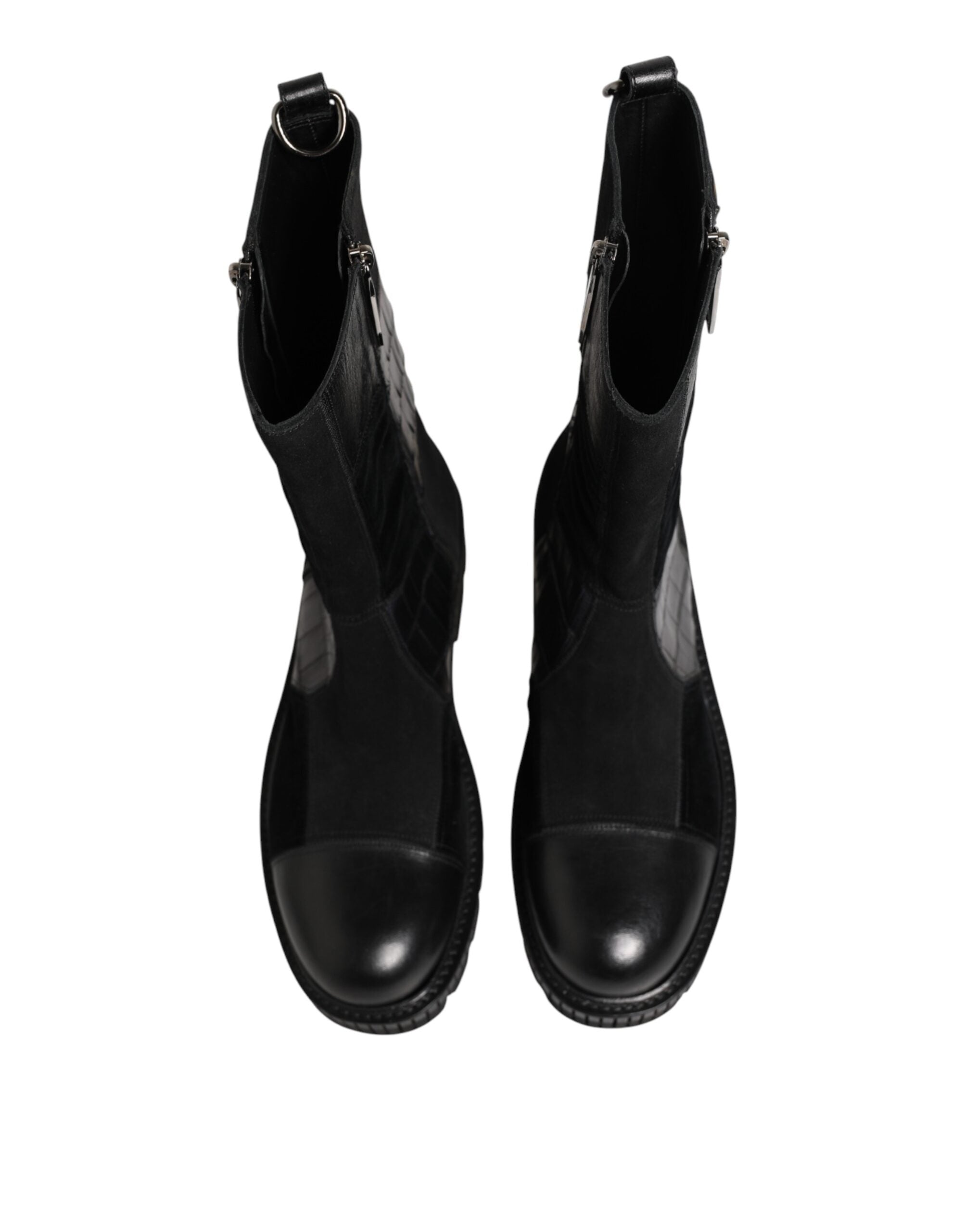 Bottes en cuir patchwork noir Dolce & Gabbana mi-mollet, style élégant et moderne, avec détails de couture visibles.