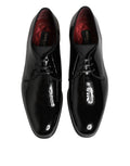 Chaussures Derby en cuir de veau noir de Dolce & Gabbana, élégantes et sophistiquées, pour homme.