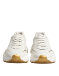 Chaussures sneakers basses Dolce & Gabbana Daymaster en or blanc, vue de face, en cuir avec semelle blanche.