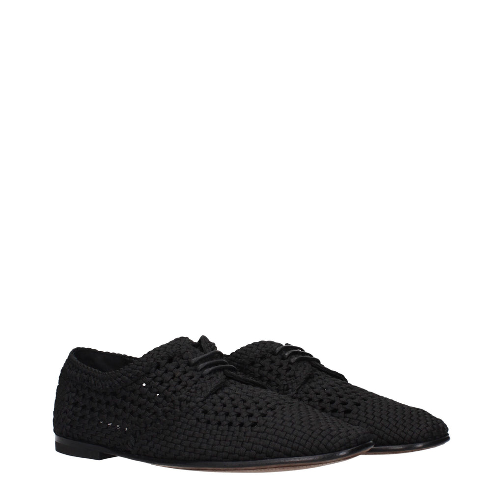 Chaussures Oxford et Derby en tissu noir de Dolce & Gabbana, élégantes et sophistiquées, visibles en gros plan.